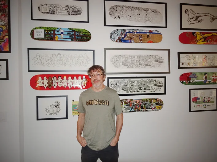 <!--pro20deckaid-->

Sean Cliver's latest project is Strangelove skateboards, but he's been killing the skate graphics game since the 80's. Here he is posing in front of some throwback boards and original drawings.