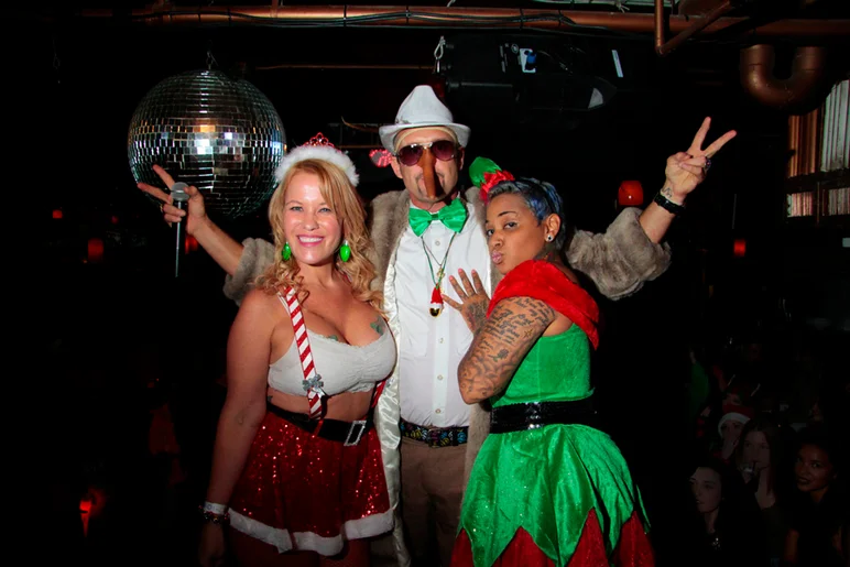 <!--brokexmas15-->

Brian with his helpers. It's time for the costume and booty shakin' contest!