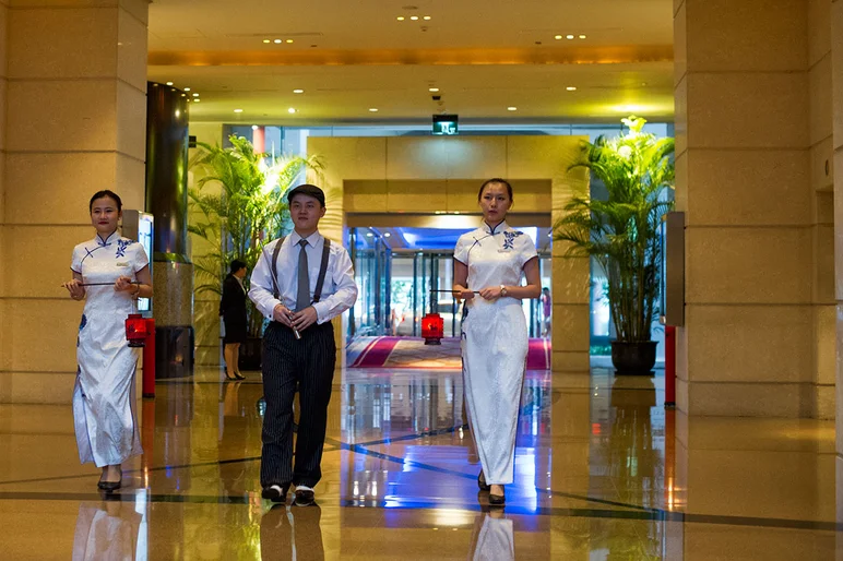 <!-- damnamchina2013 -->

We are at The Ritz-Carlton here in Shanghai and they have a ritual that cuts right through the lobby with some candles and some funny outfits.