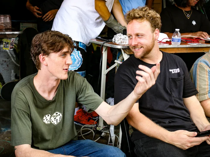 Peter trying to persuade Derick into a better score after his run.

<!--damnamnyc23-day2-->