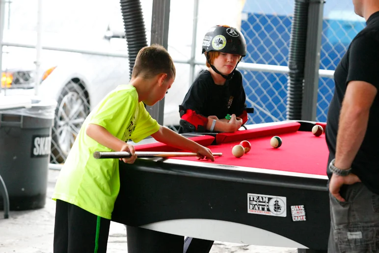 <!--soj17-->

Homies hustling hard on the pool table. Watch out these kids might roll you!
