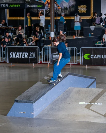 Jaelyn Sedeno testing out her 50-50 back 180 on the a-frame hubba

<!--damnamla2023-->