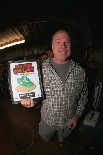 <!--ombj15-->

Dan Brown with the Oldest Old Man Award.