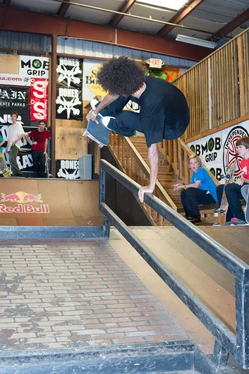 Ramante goes Koston over the rail.  The look in the back says it all.<!-- Go Skateboarding Day 2013 With Kayo -->