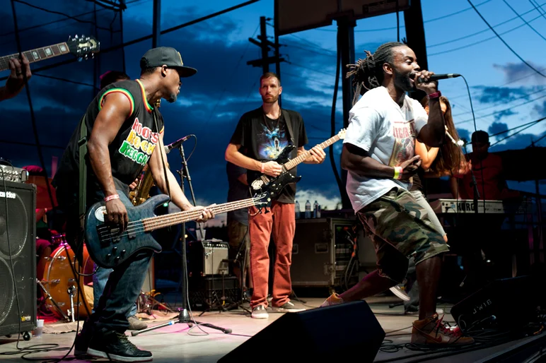 <!--ybor4year-->

Gwan Massive took the stage as the sun ducked behind the Earth around 7:30PM. I'd like to point out that this guy is wearing the Cigar City Nike Dunk, with matching T-shirt. Way to rep Tampa and the park.








