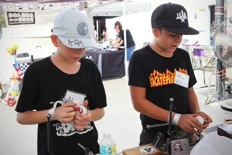 <!--mattwoodsday18-->

Can't remember the kid's name on the left, but that's Andreas Der on the right. He talked to me the whole time we were putting in bearings about how much he loves Powell Peralta. For a 13 year old, he knows a lot about classic skateboarding...I was impressed.