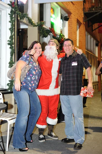 Drunk Santa's not going to let you sneak out of The Bricks without a photo.<!-- SPoT Employee Christmas Party at The Bricks 2012 -->