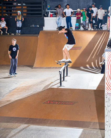 Brandon Reed flying through with a front feeble in between divisions. 

<!--harvestjam2022-->