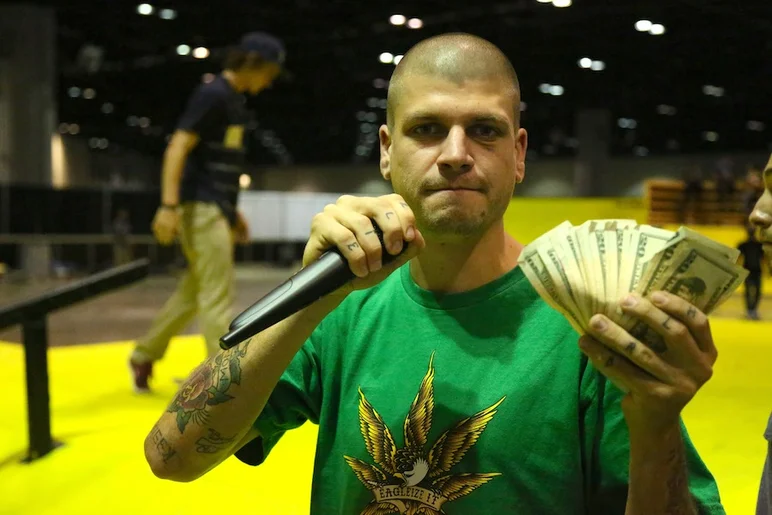 <!-- surfexpo2013 -->

Pat Mclain with some cash to hand out during best trick.