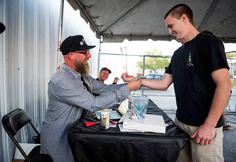 <!--pro17-fricomp-->

Gabe Clement signs em in and straps on bands with extreme enthusiasm.