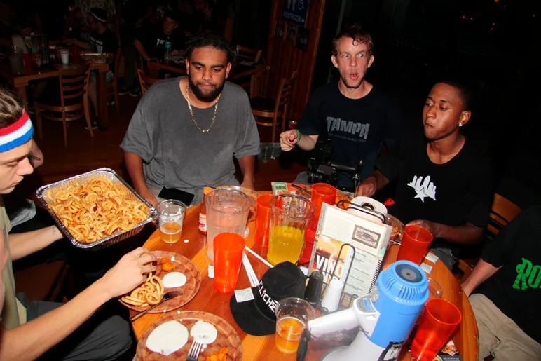 <!--ssc15-->

We arrived at Hooters and went straight to business. SPoT hooked it up with wings and fries for every table! Frank's face says it all.