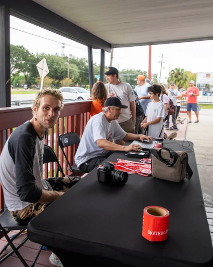 Clint and his new apprentice, Caleb, running registration in the early AM.  <!--harvestjam21-->