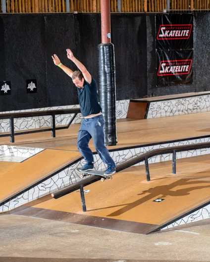 Hang-10 - Michael holding on to the back board in the 30 & up division!

<!--backtoschoolbash2022-->