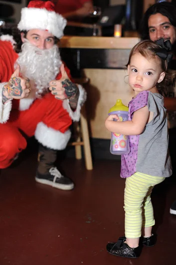 Spawn of HiDefJoe has never seen an all tatted up Santa before.<!-- SPoT Employee Christmas Party at The Bricks 2012 -->