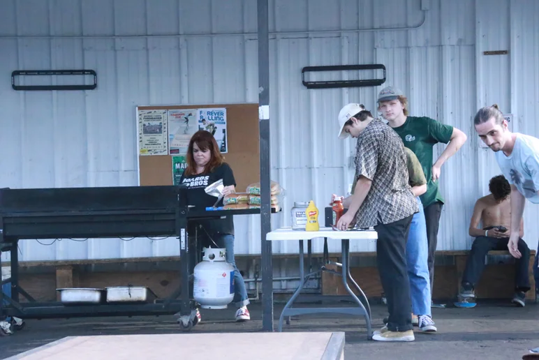 <!--emericaphotos16-->
Who doesn’t love free food, right? These two dudes came out to see what Made Chapter Two was all about, and got some free BBQ too. Oh, and is that a young thin Jamie Foy in the background?