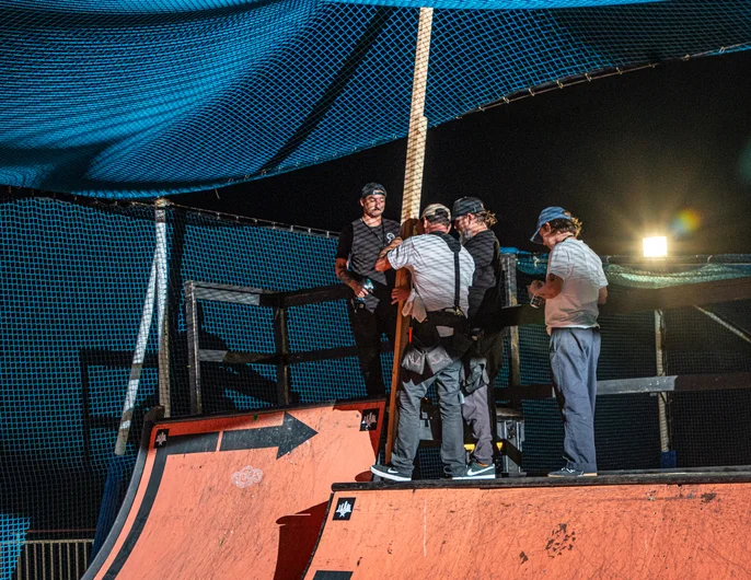 Brian and the boys putting some final touches on the Goat Ramp so we were able to catch some air. They had a net over the court where the ramp was built so these wooden pillars gave us some room to breathe!

<!--floggingmollycruise23-->