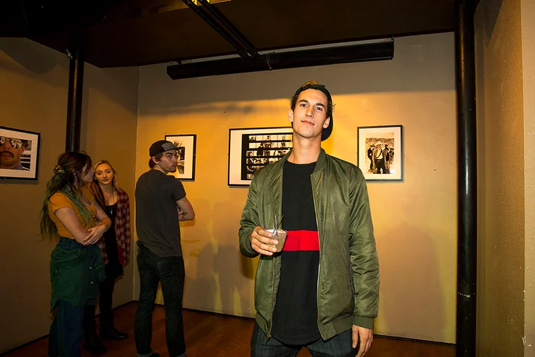 <!--pro16frinight-->

David Loy checking out some of Spike's prints.