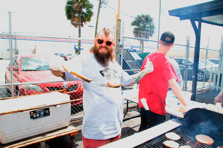 <!--vans50th-->

Aaron the grillmaster making free burgers and hot dogs for everyone.