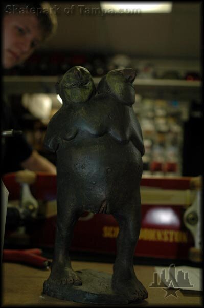 Two headed naked statue with five tits