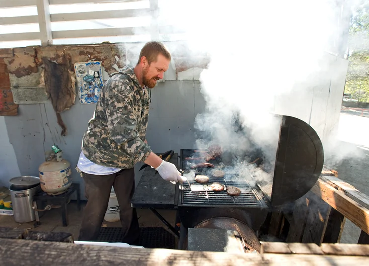 <!--DA-ATL16-1-->

Hazard County park owner Jona Owings smokes up some goods.