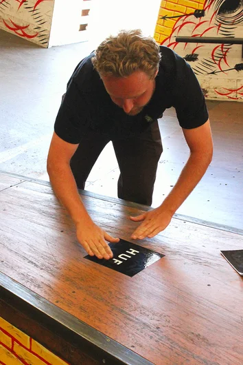<!--huf001vidpremiere-->
1.Event Coordinator Derick Glancy, laying those HUF stickers and prepping up for the Best Trick Contest. 
