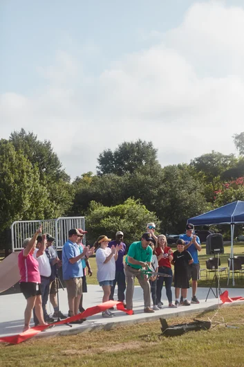 The people of Huntsville cutting the ribbon to open their new skatepark! <!--b4btexas21-->