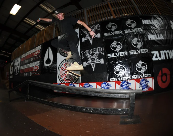 <!--tampapro2014-->

Timmy Knuth is a Floridian and has a mean kickflip. He's taking it to front crook on the rail in this photo.
