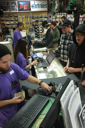 Just a small part of the staff killing it this weekend - Josh, Alex, and Tom.  Everything is purple.<!-- Black Friday at SPoT Presented by Vans 2012 -->