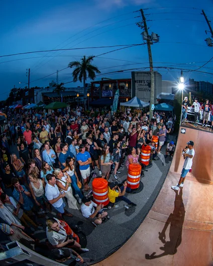 Alex looks like he is prepping the crowd for battle. I suppose the best trick contest later in the evening was pretty close to a battle!

<!--skatingacrossborders2022-->