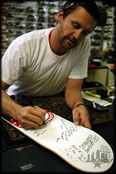 Brian Schaefer signs a deck