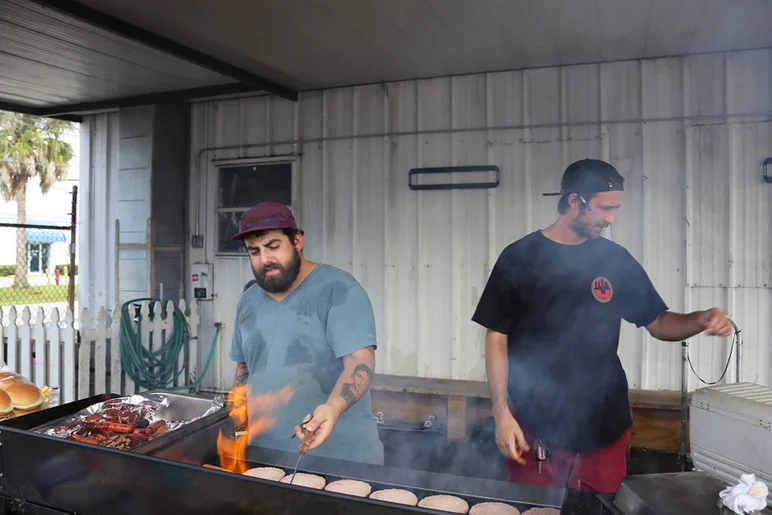 <!--eotmjuly-->

The maintenance dudes are by no means strangers to clouds of smoke. Here they are finessing the grill just like any other event.