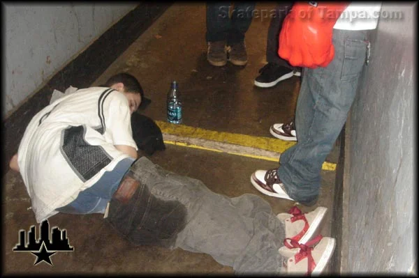 Tampa Pro 2006 Random Lurkers<BR>
Robbie Kirkland ended up here during the Tampa Pro Party.  Damn, someone pull his pants up for him