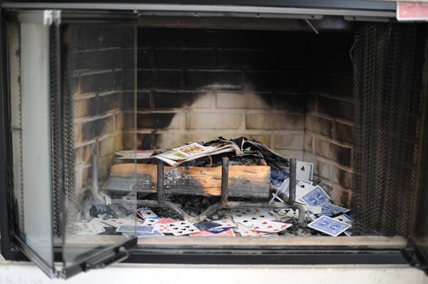 Right above the fireplace is a cup for cards
