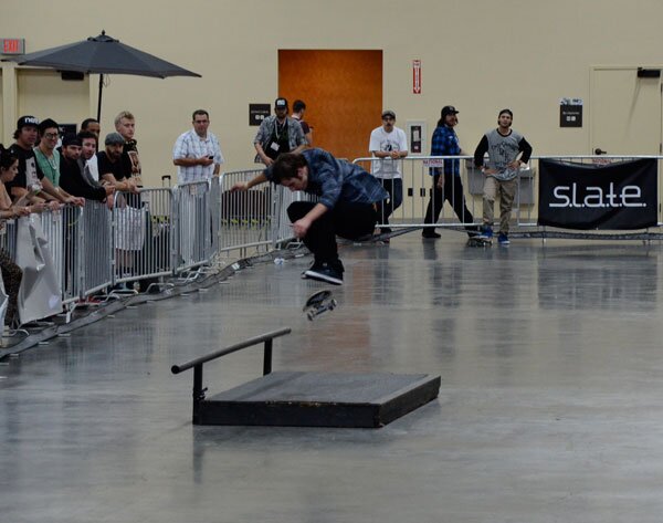 Jimmy Carlin with a kickflip over the box