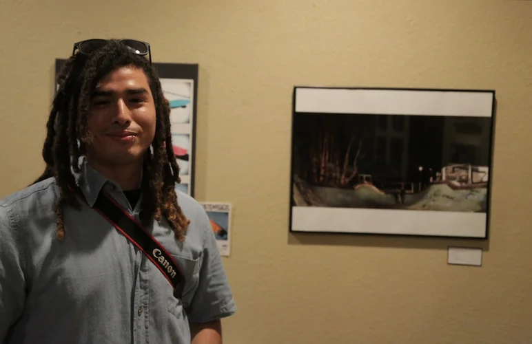 <!-- thebricks3year -->

This is James Heredia with one of his photos in the show. He made it out from Miami.