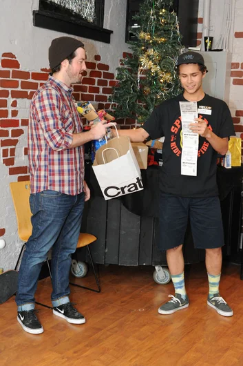 Treshan got a strip of scratch offs.  He ended up going for Alex's socks.<!-- SPoT Employee Christmas Party at The Bricks 2012 -->