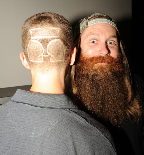 <!-- shaqueefapremiere13 -->

Big Al, Allen Russell, with the smoothest skateboarder this side of the planet, Jimmy Lannon. Jimmy had his homey cut the Shaqueefa logo into the back of his dome for the premiere. So ill.