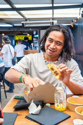 The find here was incredible. Just look how happy Sam is while eating this Nashville Hot Chicken Sammy. That's right. A Nashville Hot Chicken in the Netherlands

<!--damnamnetherlandsday3-->