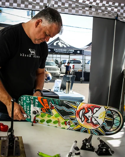 <!--cotc20photos-->

The day begins at the Boards for Bros tent, where a few guys from the Black Sheep crew helped assemble skateboards for kids in need.
