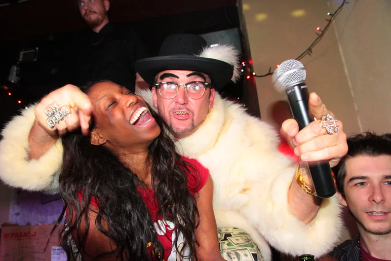 <!--gx14-->

MC Brian Schaefer was dressed to kill in a fur coat with the winner.