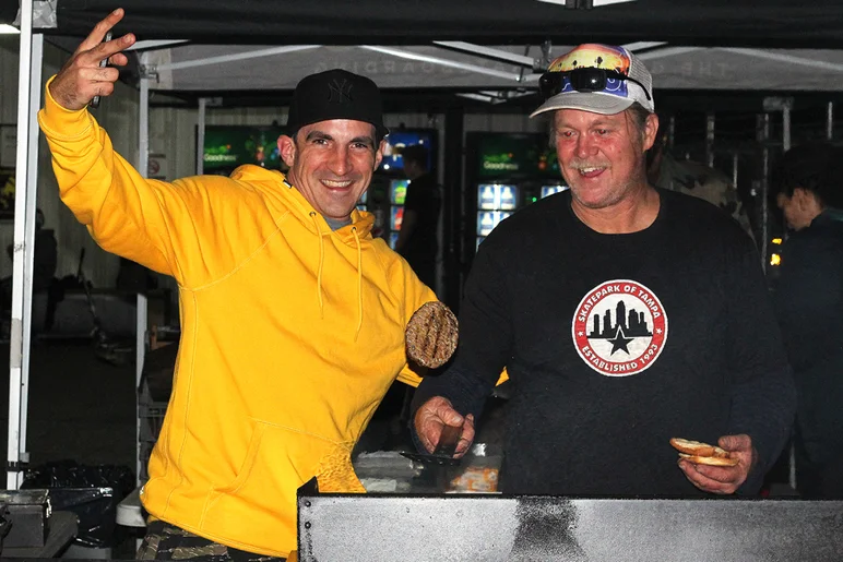 <!--cotc18photos-->

Pete flipping burgers with Alec.
