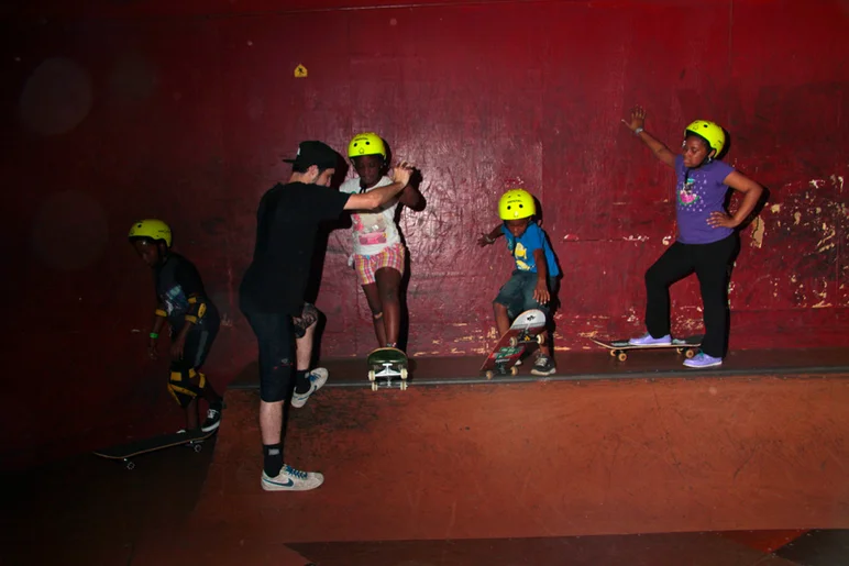 <!--b4bday15-->
Sam was one of our volunteers and he was killing it. He had all of these kids lined up waiting to learn how to drop in.