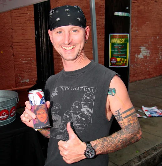 <!--bricks5year-->
The beers began to flow! Crazy for Swayze! Check out that coozie. Shawn Watkins plays drums for one of the first bands to hit the stage: Tampa locals, The Tim Version.