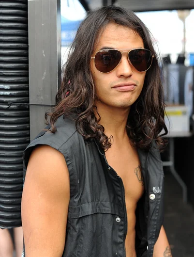 <!-- tampapro2014qualifiersaaronandfrank -->

Former SOTY winner David Gonzalez relaxing outside after qualifying 22nd today. David looks tired, but not from skating-- he's tired from constantly telling all the ladies no... or yes.. who knows?