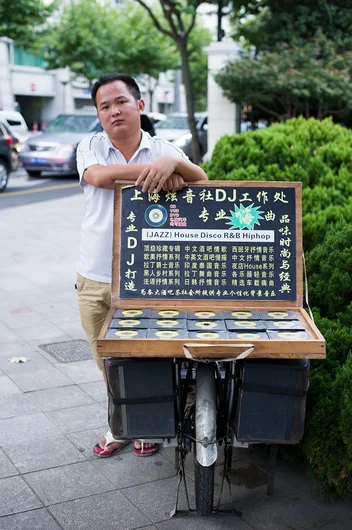 <!-- damnamchina2013 -->

We ventured out in the streets of Shanghai and found these mobile DJ's trying to make some RMB selling some pretty awful mix tapes.