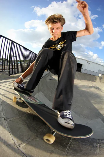 <!--conspurpvidfoto-->

Evan Tieman rips as you can see here. : Grab N Grind around the corner pocket.