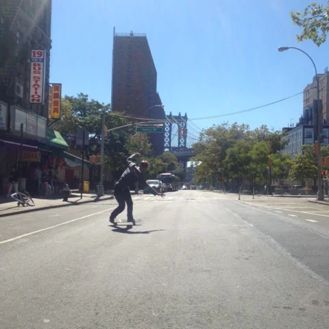 <!--NYCRT-->

Cameron Hunt powerslides through Chinatown.
