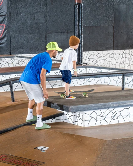 Father of the year or helicopter parent? Either way he was on the course to walk all three of his kids through their runs in a pair of slides!

<!--backtoschoolbash2022-->