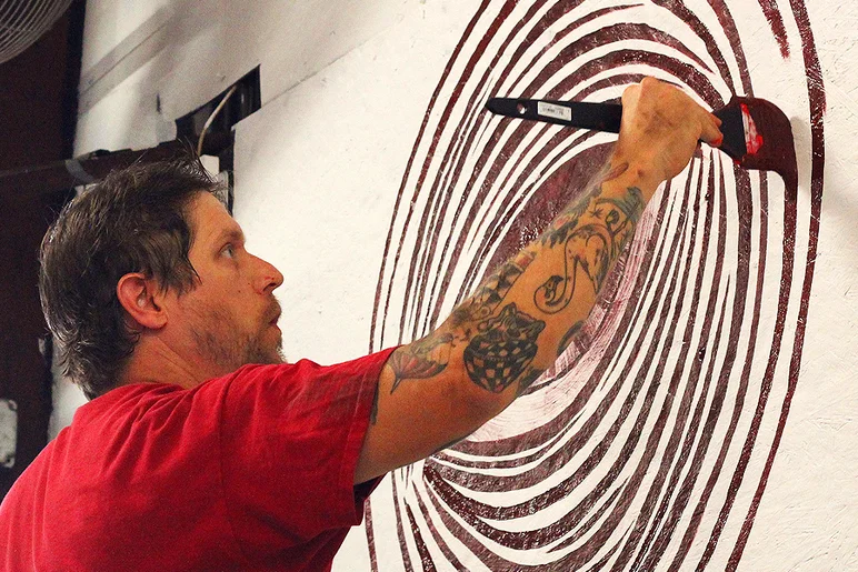 <!--schoultzpaint-->

Andrew gets started with the wall behind the judges stand.


