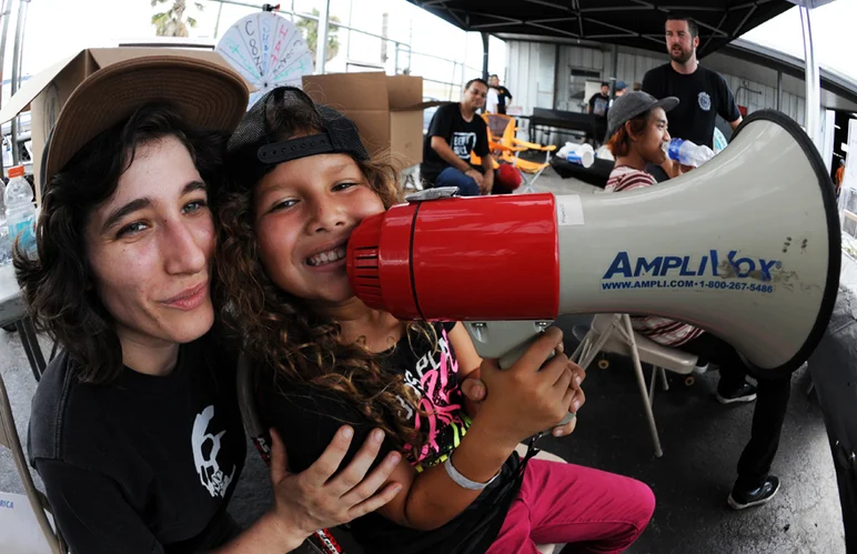 <!-- backtoschoolbash2013 -->

The Puerto Rican princess Gia Mar Matienzo took over the megaphone in the SPoT Wheelbiters tent after competing in her first contest. Christina Sanchez can only smile.